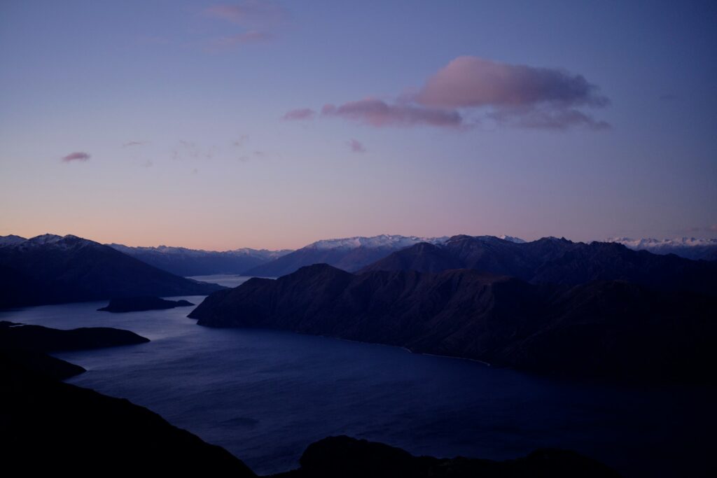NZ lake and mountains at dusk — Kingstone+ hero background